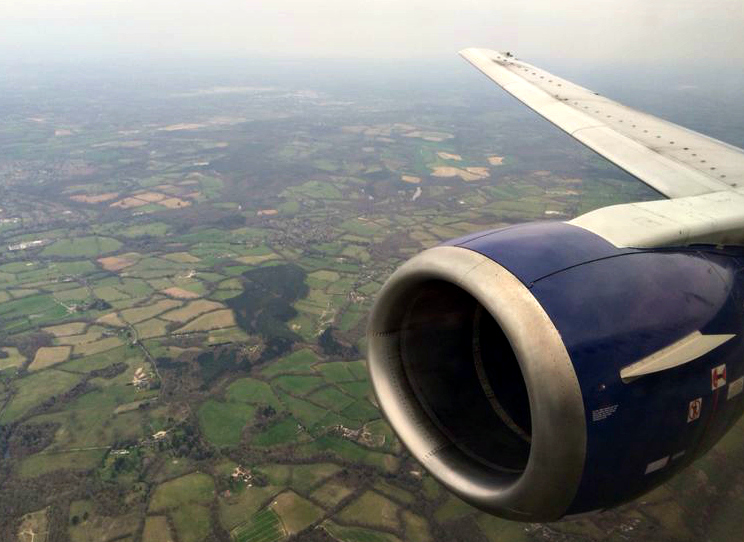 80 pairs of shoes up in the air with british airways amsterdam to gatwick aerial view