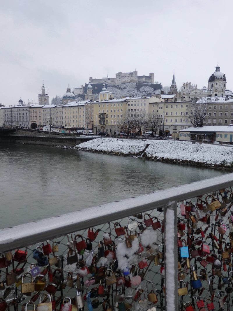 Austria Travel Inspiration48 Hours in Salzburg, Austria in Winter. This European city is a beautiful destination whichever season you decide to visit however with the Christmas Markets to explore in December and snow, it's like you are inside your own beautiful snow globe. Pop on over to the blog to read my travel guide to Salzburg and tips including gluten free food advice. #salzburg #austria #beautifuldestinations #bucketlistideas #80pairsofshoes 